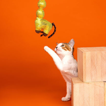 Fringe Studio catnip kicker toy showcasing the shiny spotted fabric and reflective details.