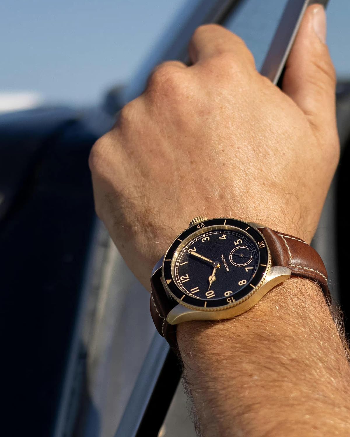 REZERO dark brown oil waxed leather watch strap layout on a dark background