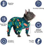 Spark Paws dog apparel in teal dinosaur pattern highlighting the calming fleece interior.