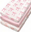 SmoothNovelty pink bow baby changing pad cover set front view