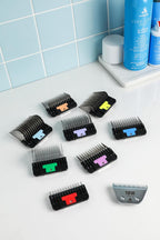 Close up of Andis color coded stainless steel comb teeth