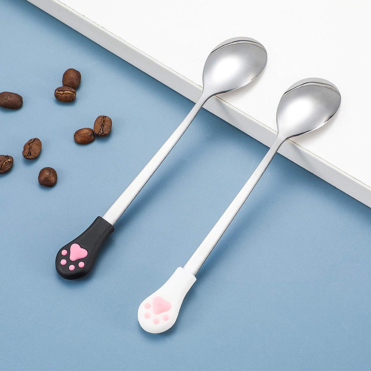 Set of four Patelai pet food spoons in black and white