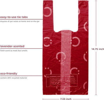 Red leak proof pet waste bags with easy tie handles close up.