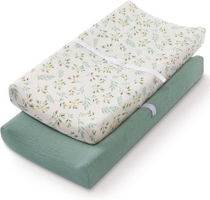 Blissful Diary muslin changing pad cover front view showing Roman Green and Botanical Leaf patterns