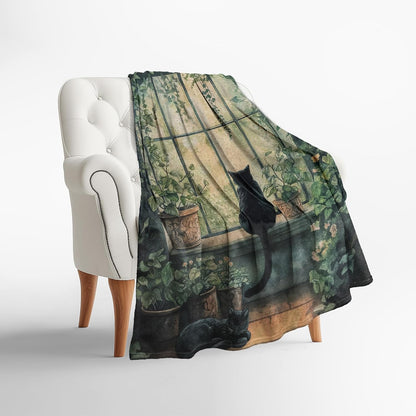Levens window black cat blanket folded neatly as a gift presentation.