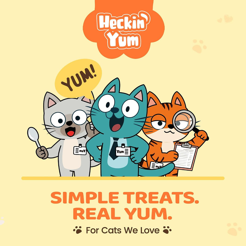 Heckin Yum pumpkin cat topper held in hand for scale