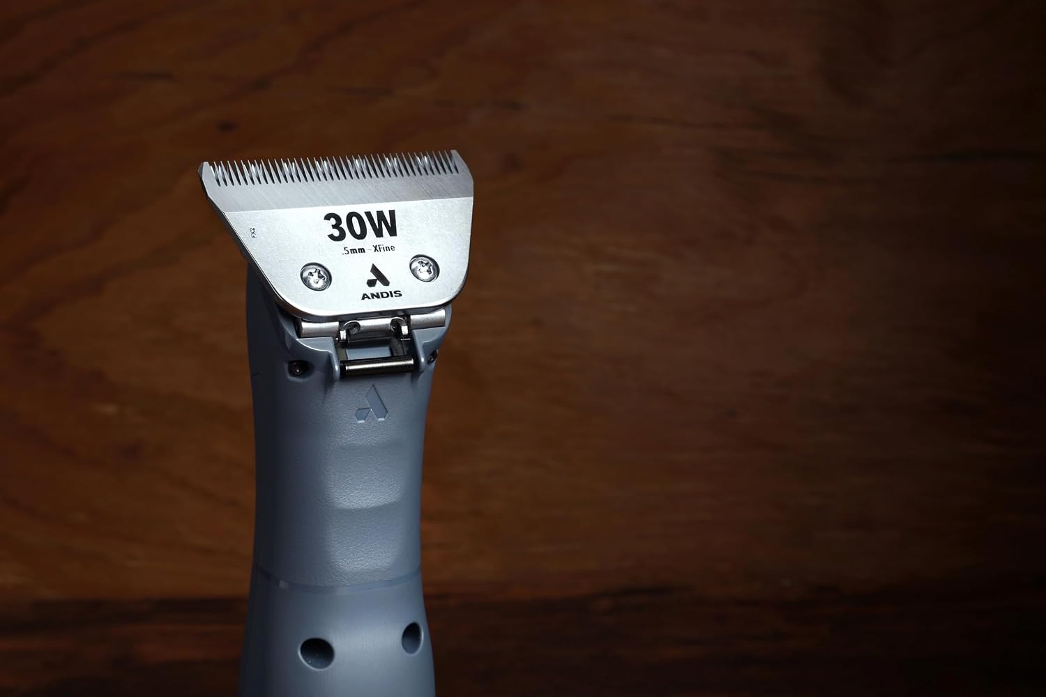Close up view of thirty one tooth ceramic cutter on Andis wide blade