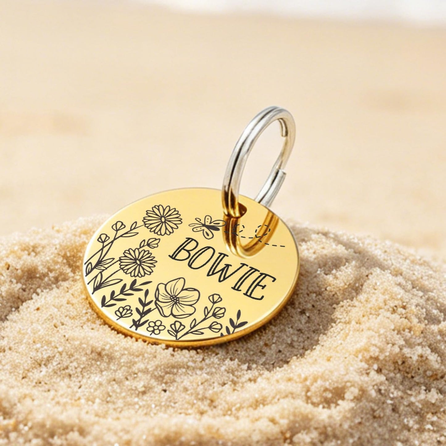 Customizable stainless steel dog tags with mountain and floral patterns.