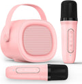 LENRUE karaoke machine for kids front view showing the pink speaker with handle and dual wireless microphones.