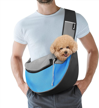 Owner wearing Pawaboo pet sling carrier with small dog inside