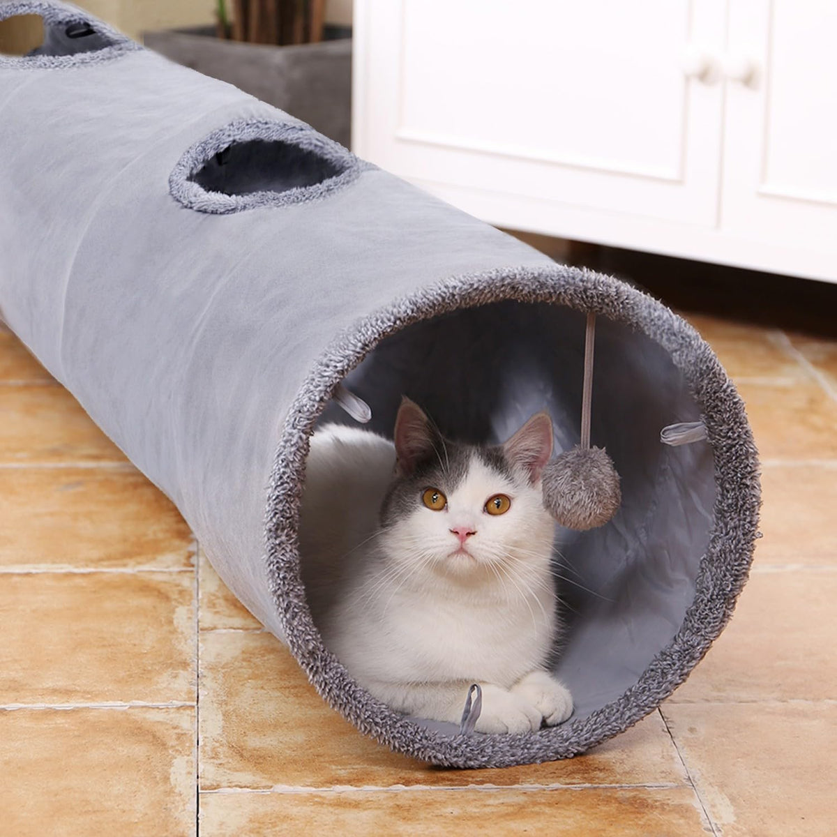 PAWZ Road large suede cat play tube with a dangling toy ball at the entrance