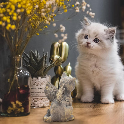 Angled view of the gray cat remembrance statue highlighting the paw print engraving