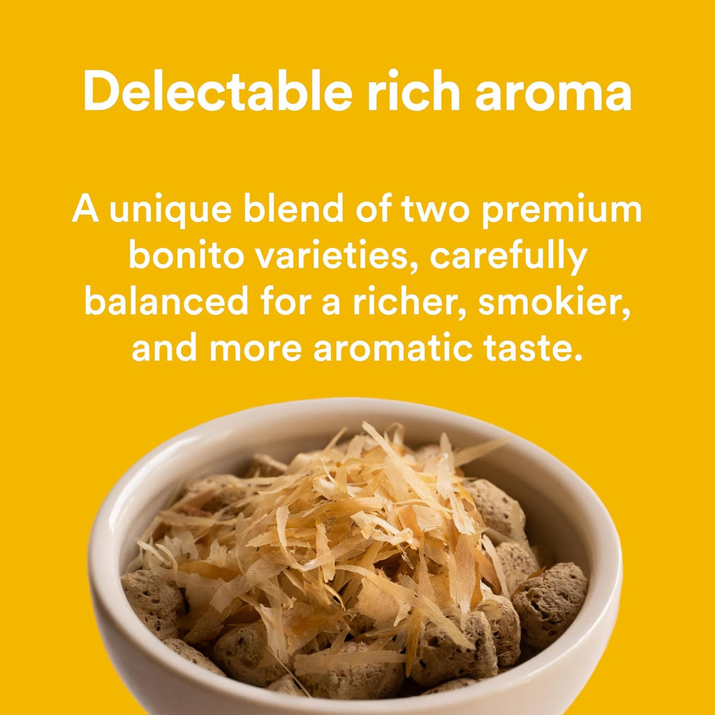 Bonito House flakes being sprinkled on dry pet food