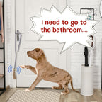 Puppy touching hanging dog bell for potty training