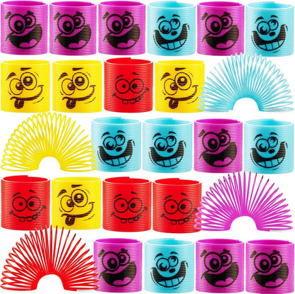 Bedwina Mega Pack of 50 Coil Springs front view showing various colorful mini plastic spring toys with silly emoji faces.