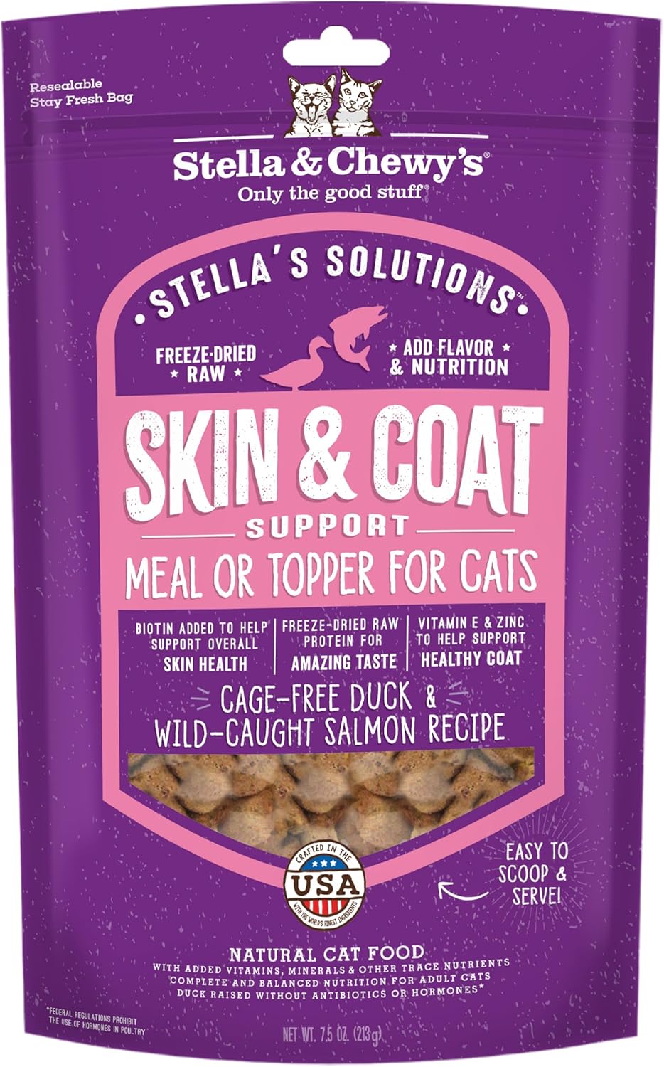 Happy cat eating from a bowl with Stella & Chewy's mixer added