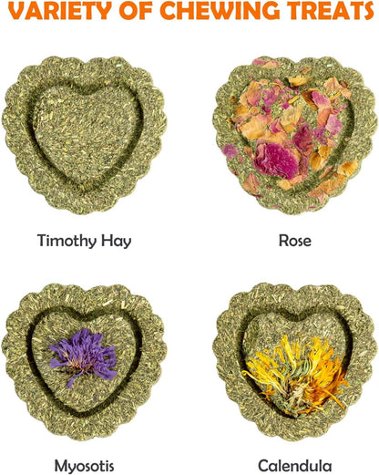 Handmade heart-shaped timothy hay cakes with dried flower toppings for rabbits.