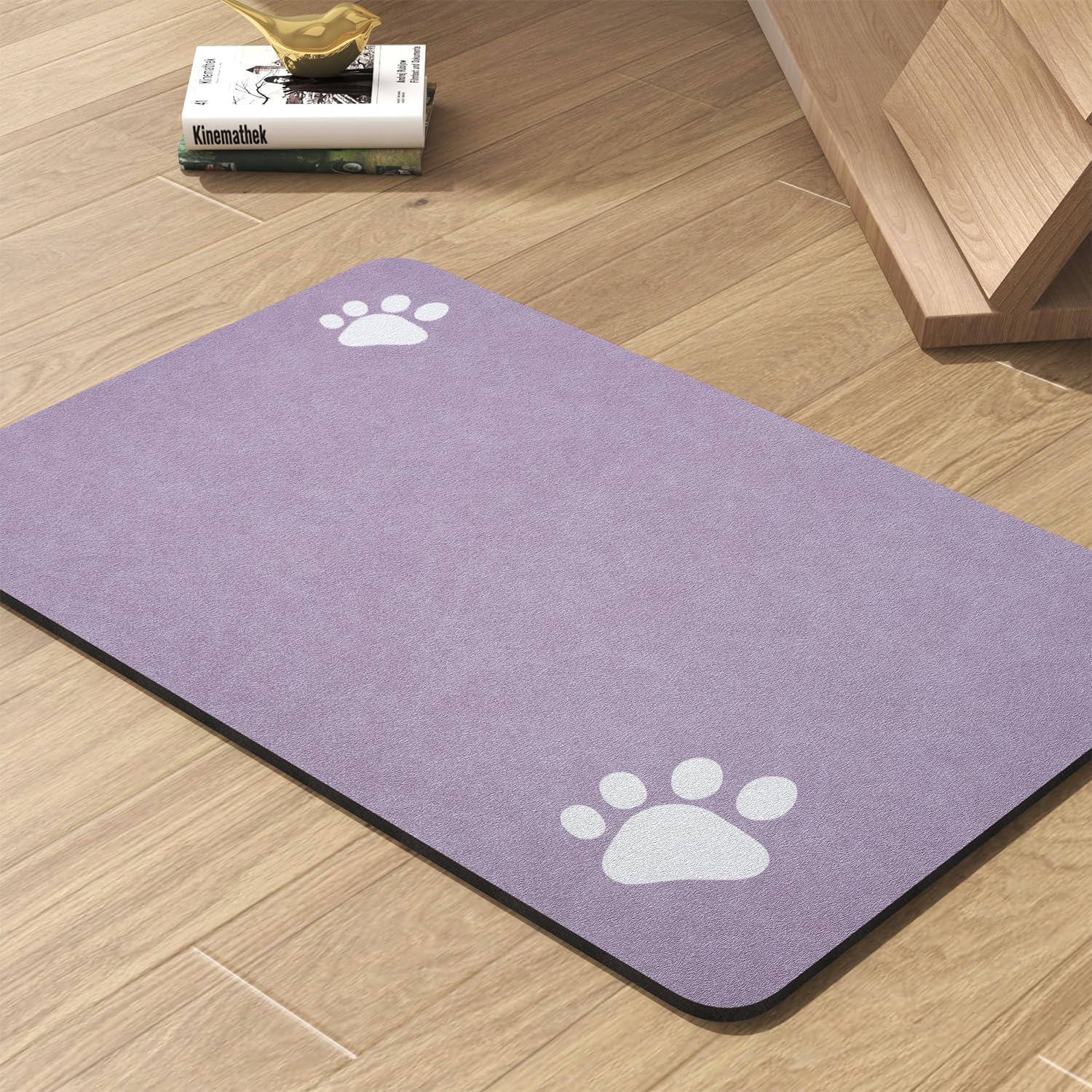 Beige pet placemat for messy drinkers with water bowls arranged on top
