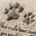 Outdoor sympathy gift stone in a garden setting