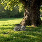 Weatherproof sleeping kitten garden statue with stone finish close up.