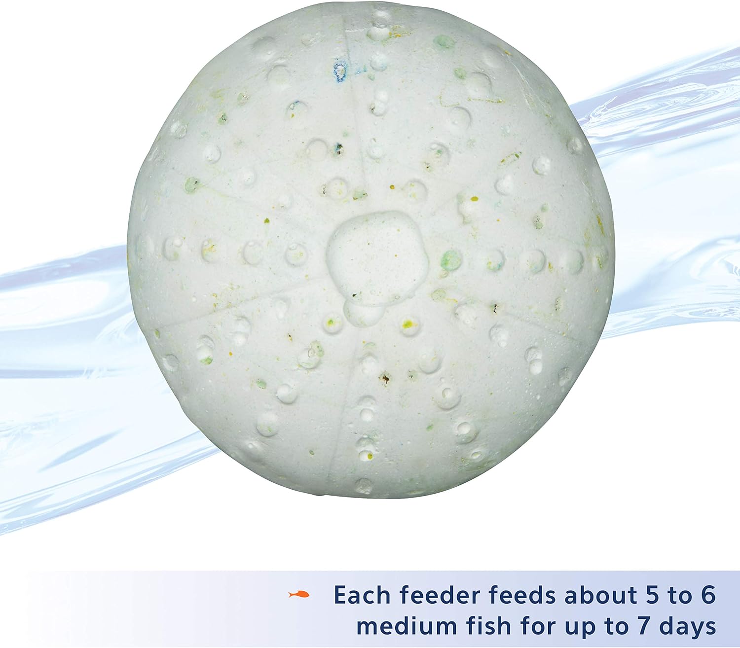 Nutritious fish food pellets released from slow dissolving block for tropical fish