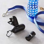 Close up view of the printed arrows indicating the opening of the Amazon Basics dog poop bag.