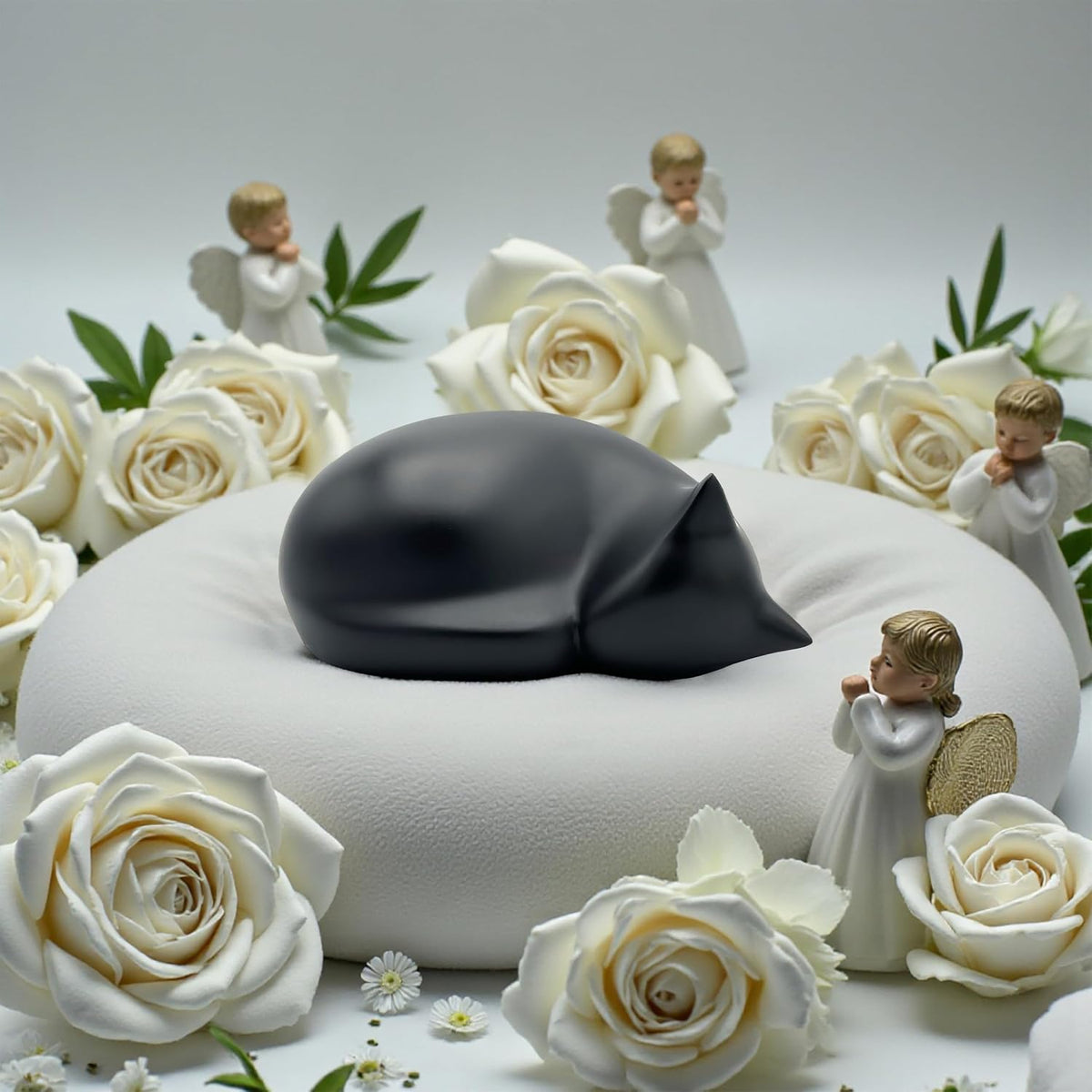 Comemori matte black resin cat cremation urn showing smooth hand-sculpted details