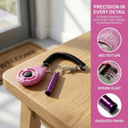 Matte pink behavior correction clicker with purple distance training whistle close up