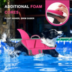 Side view of pink dog swim vest highlighting the fun shark fin design