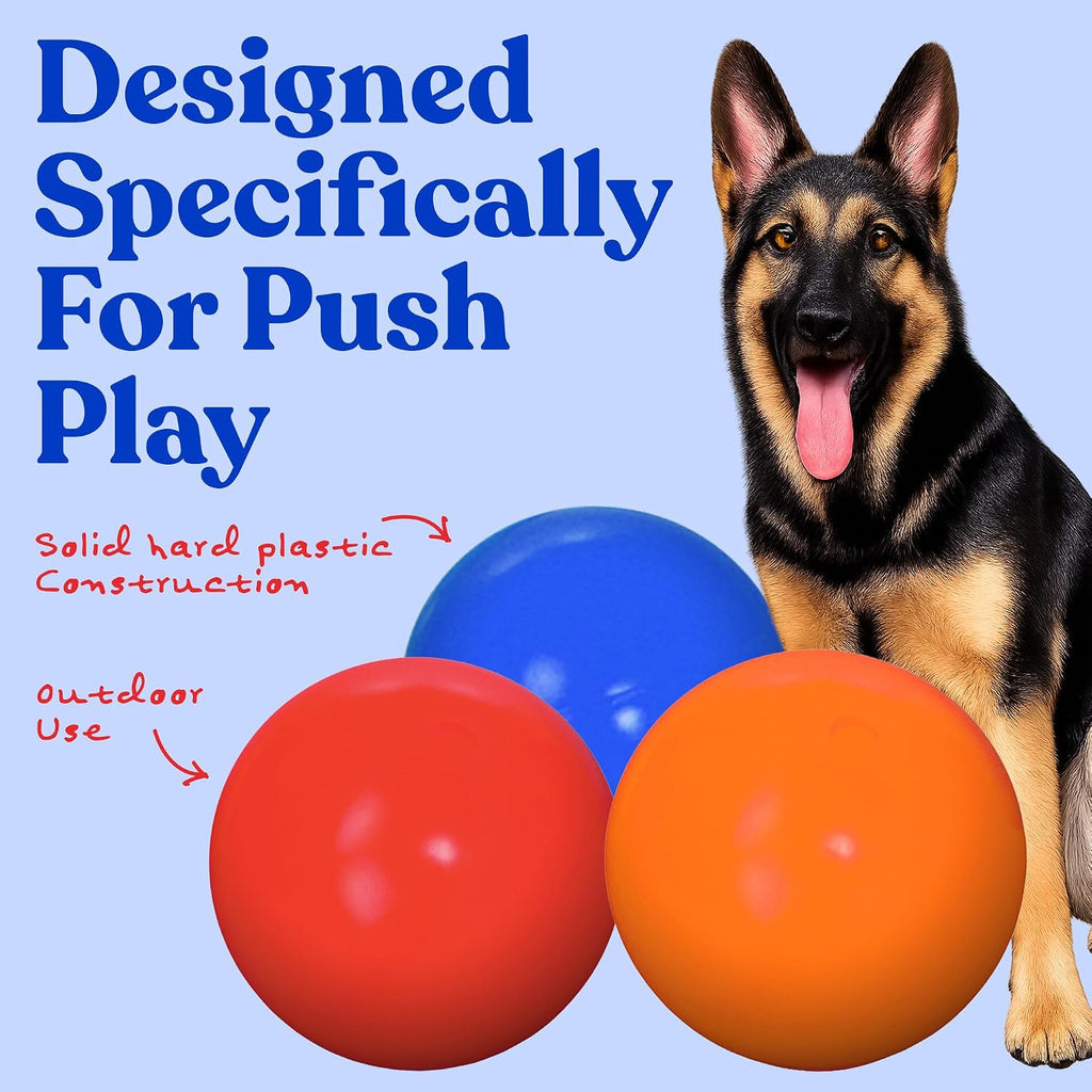 Red hard plastic herding ball for large dogs on grass