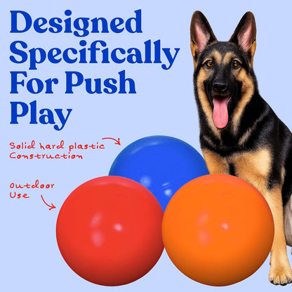 Red hard plastic herding ball for large dogs on grass