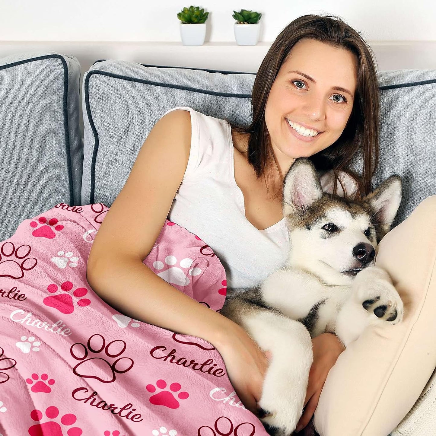 GlisterGlow customized pet throw blanket spread out neatly on a living room sofa
