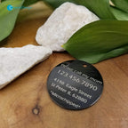 Twenty&Sixty engraved floral dog tag laying flat to show the detailed craftsmanship and smooth edges