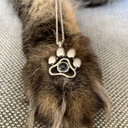 OPALSTOCK pet memorial jewelry showing how a smartphone flashlight projects the pet photo