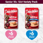An aging cat enjoying the smooth texture of Delectables bisque lickable wet cat treats from a bowl.
