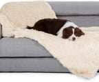 Large cat curling up on the soft calming flannel side of the Gogobunny furniture protector.
