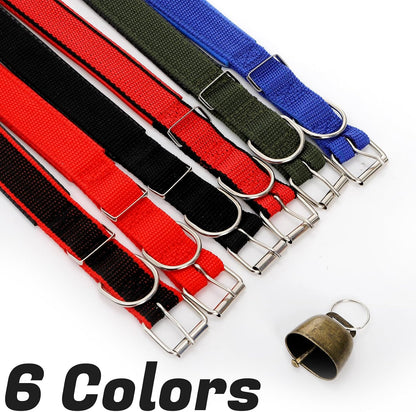 Twelve piece set of colorful goat tracking collars with metal bells spread out to show the complete assortment.