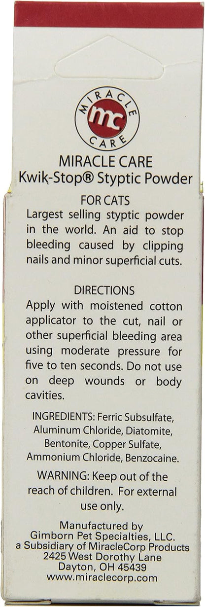 Applying Gimborn Kwik Stop powder to a cat nail during grooming first aid.