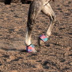 Side profile of the anatomically designed Classic Equine Dyno Turn horse boots in medium size.