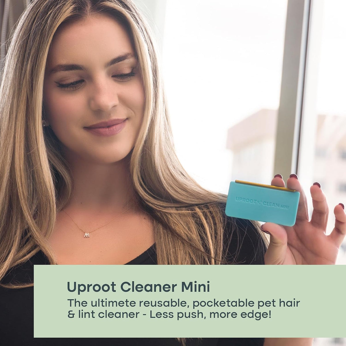 Side profile of Uproot Cleaner Mini demonstrating ergonomic handle