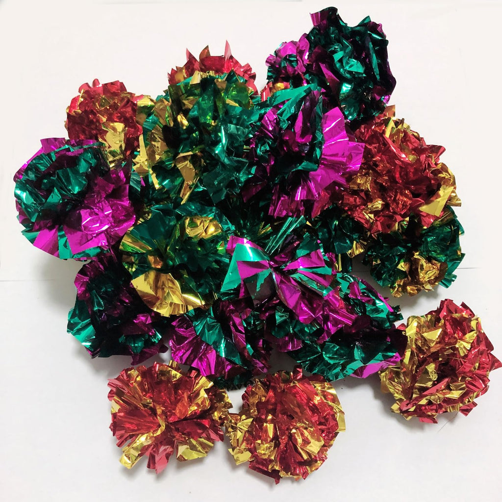 Overhead view of colorful PETFAVORITES Mylar pet toys displaying lightweight crinkly texture