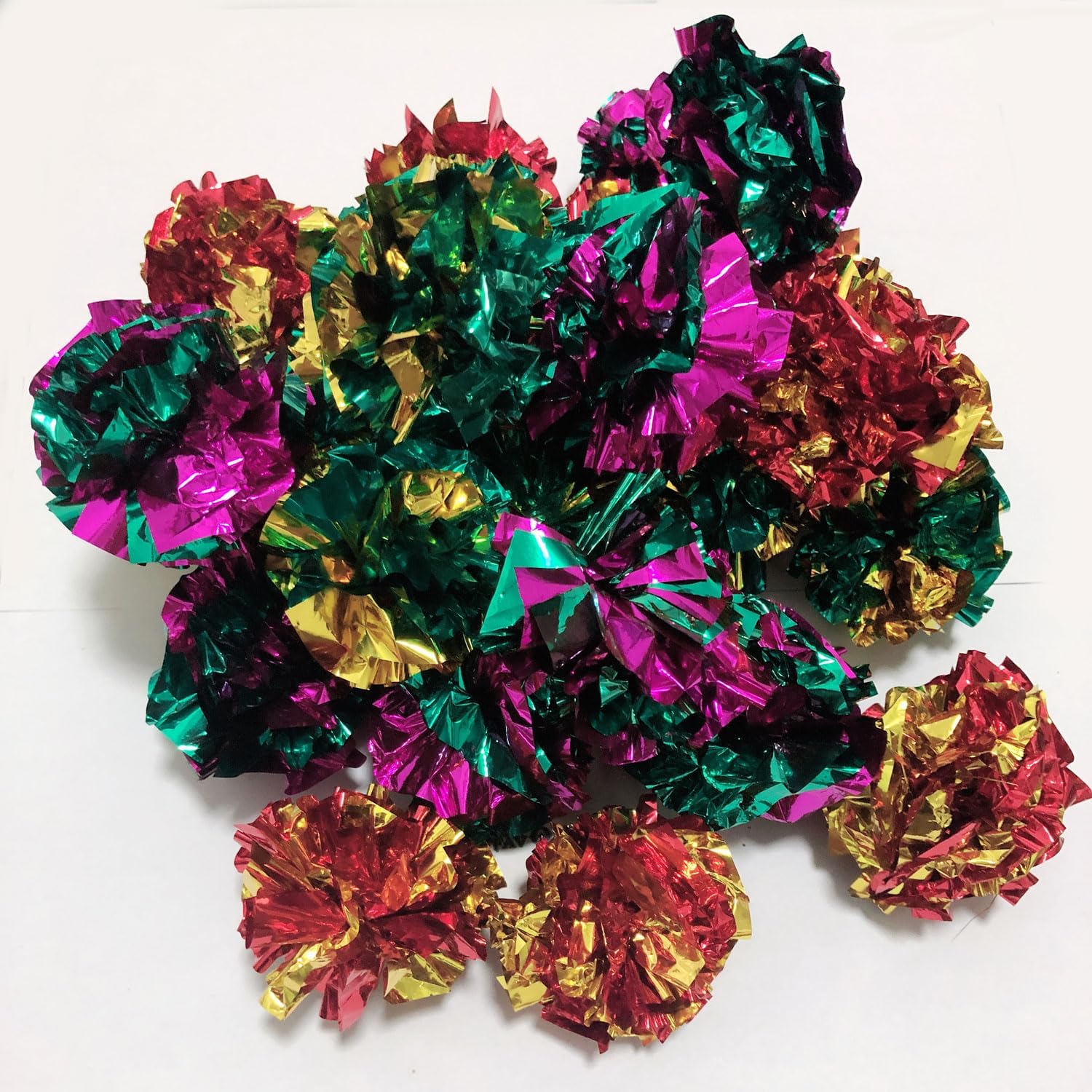Overhead view of colorful PETFAVORITES Mylar pet toys displaying lightweight crinkly texture