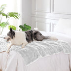 Close up view of the water resistant backing on the white dog blanket throw.