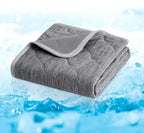 Cozy Bliss waterproof cooling throw protecting a bed from pet drool and liquids.