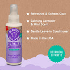Buddy Splash grooming spray held in hand for size reference