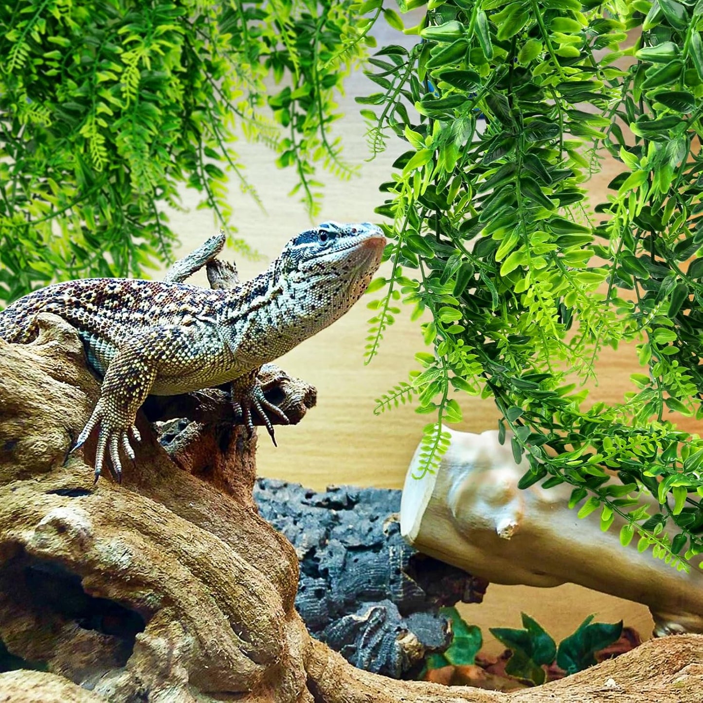 Quozuo reptile tank accessories featuring realistic green foliage.