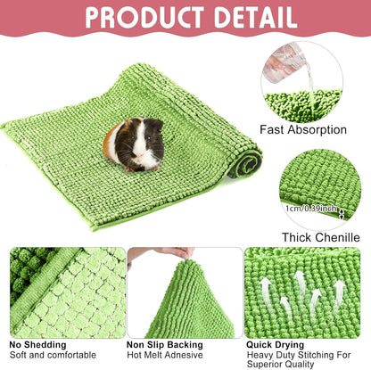 Green and pink reusable small animal pee pads in a cage