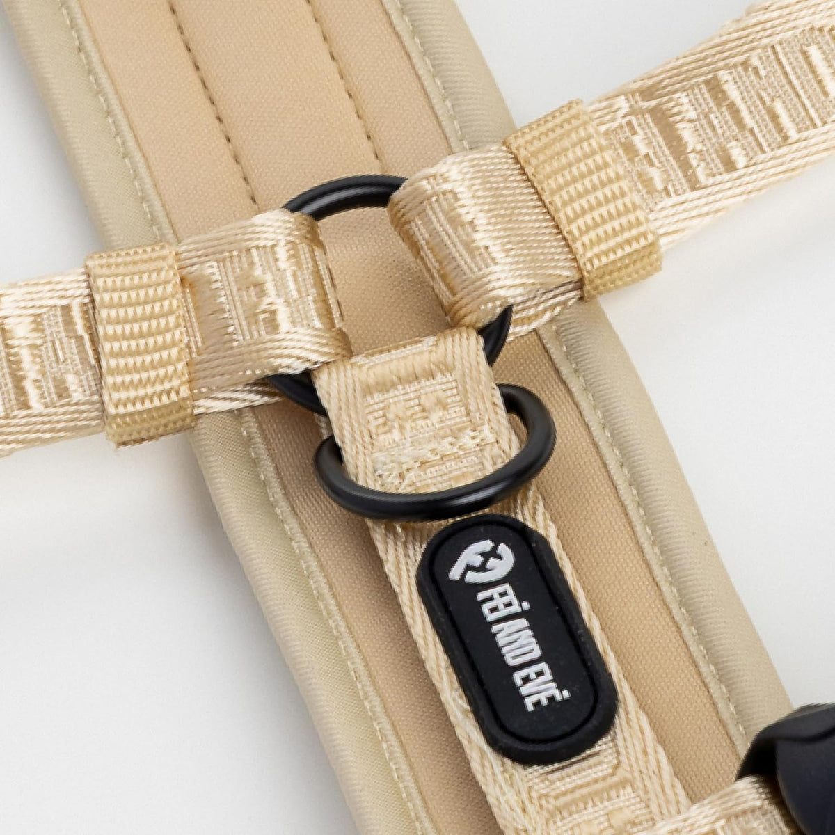 Side view of dog wearing Fei and Eve champagne harness