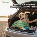 Medium size dog wearing green dinosaur hooded fleece jacket for winter warmth