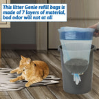 Apatal cat litter liners being installed into an empty refill cartridge shell
